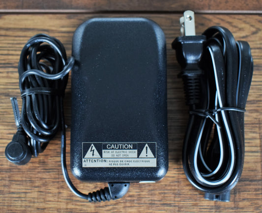 Casio AD-A12150LW 12V AC 1.5A Center Positive Barrel Power Supply Open Box